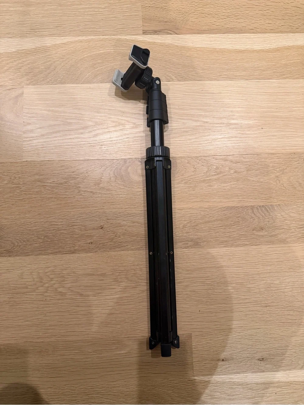 Compact Black Smartphone Tripod with Adjustable Phone Mount